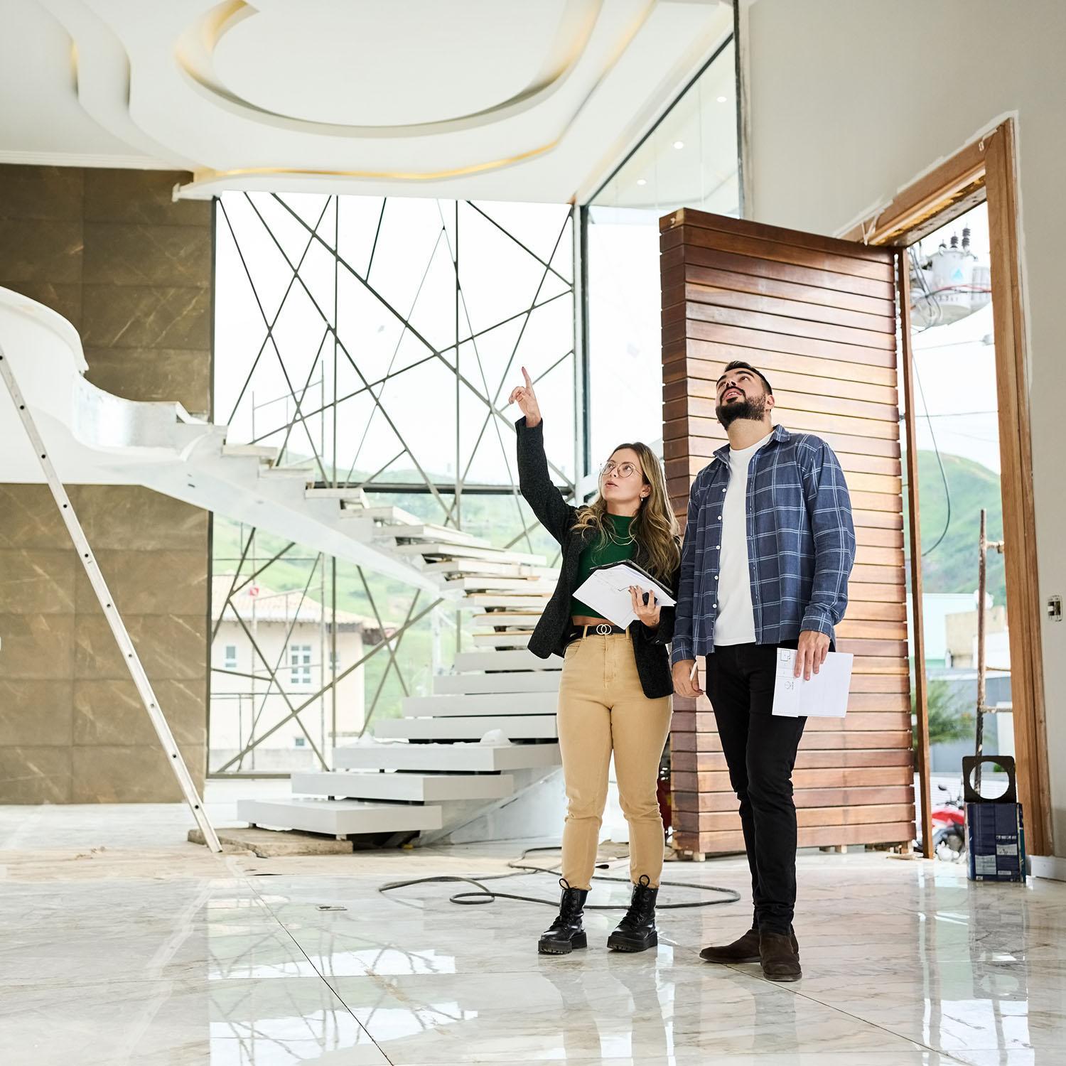Two-people in large foyer during an acoustic consultation